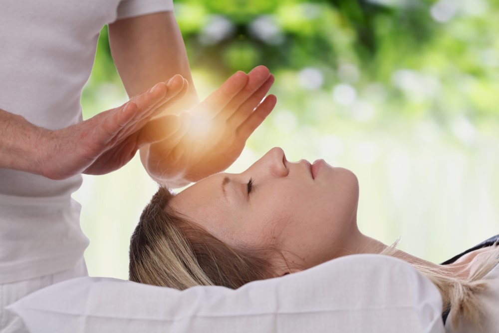 Light coming from Reiki practitioners hands.